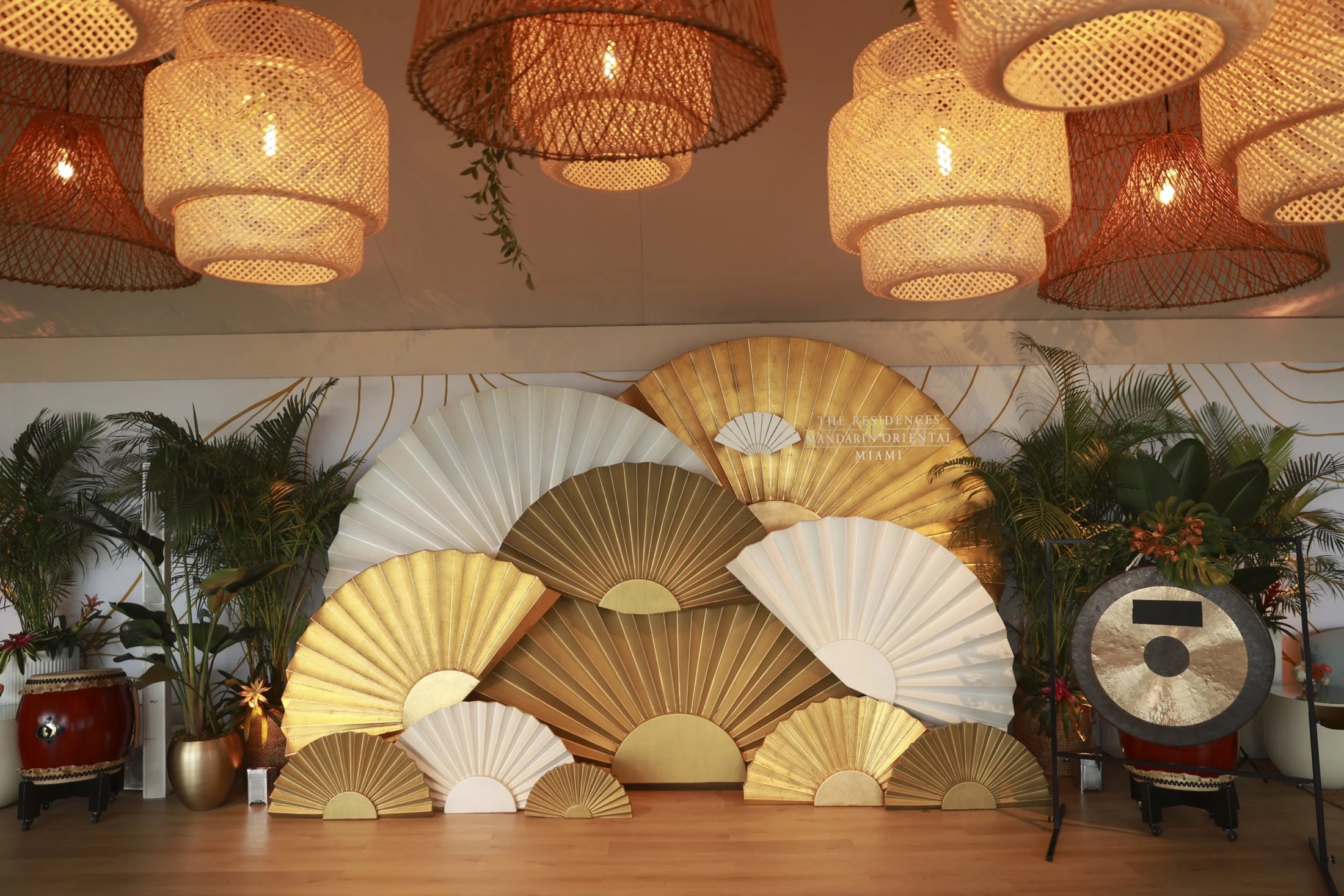 A lounge dressed with paper fans and woven lanterns