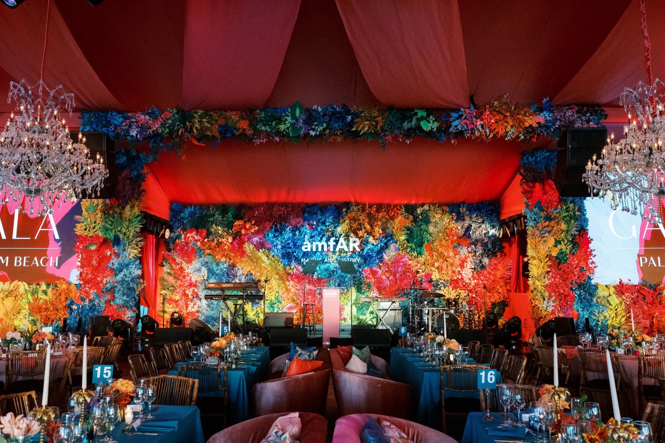 A gala room built from walls of flowers and colour for a charity dinner